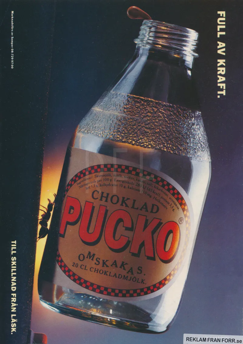 Reklam för chokladdrycken Pucko som med sloganen Full av kraft illustreras av en myra som lyfter upp en flaska Pucko